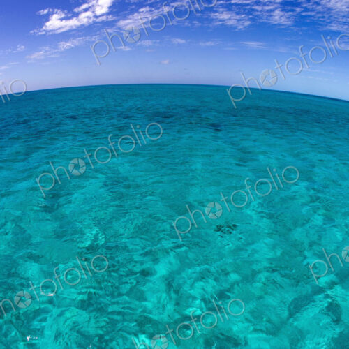 Clear water and sky, Curved horizon line.
