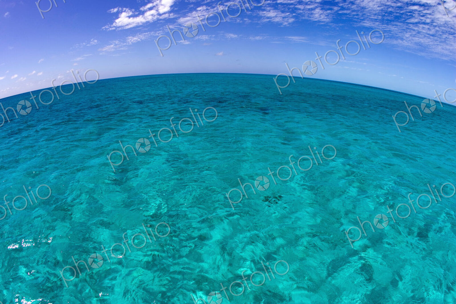 Clear water and sky, Curved horizon line.