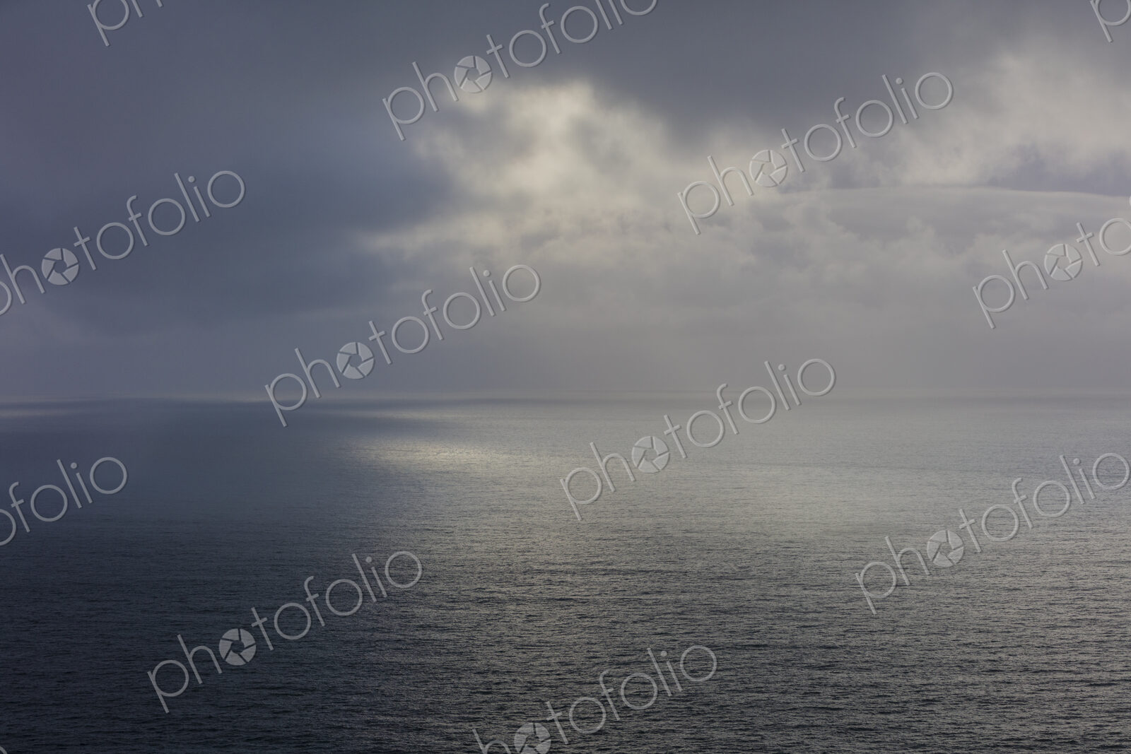 Clearing storm over vast ocean at dusk, Oregon