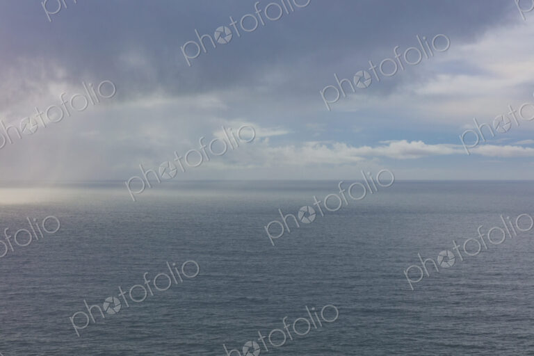 Clearing storm over vast ocean at dusk, Oregon