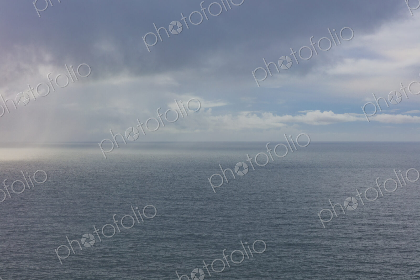 Clearing storm over vast ocean at dusk, Oregon