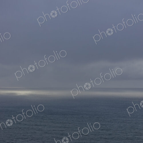 Clearing storm over vast ocean at dusk, Oregon