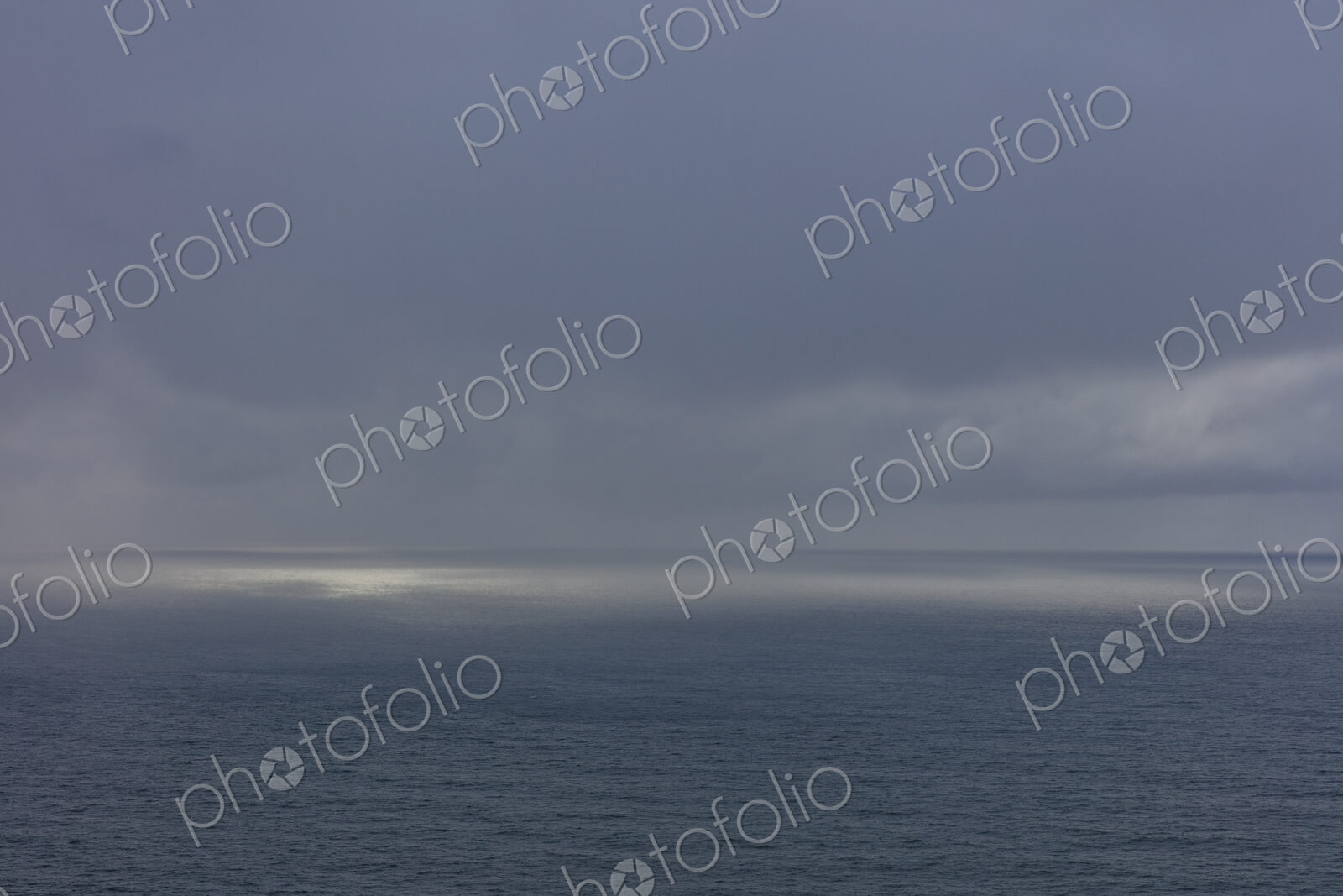 Clearing storm over vast ocean at dusk, Oregon