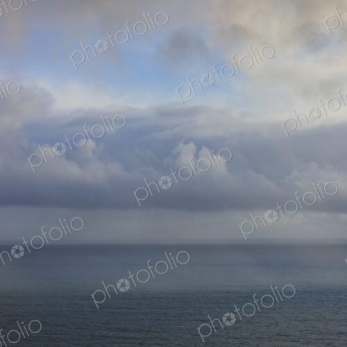 Clearing storm over vast ocean at dusk, view from the Oregon coastline.