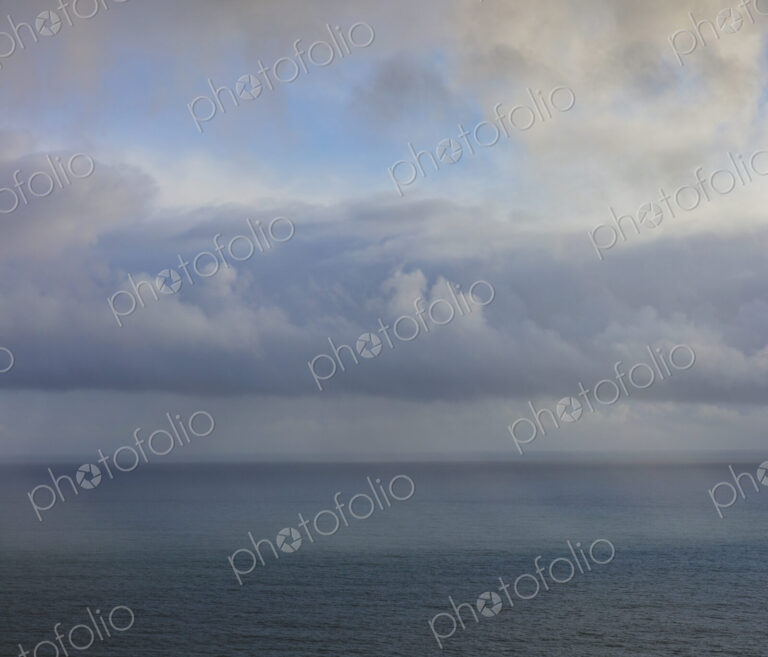 Clearing storm over vast ocean at dusk, view from the Oregon coastline.