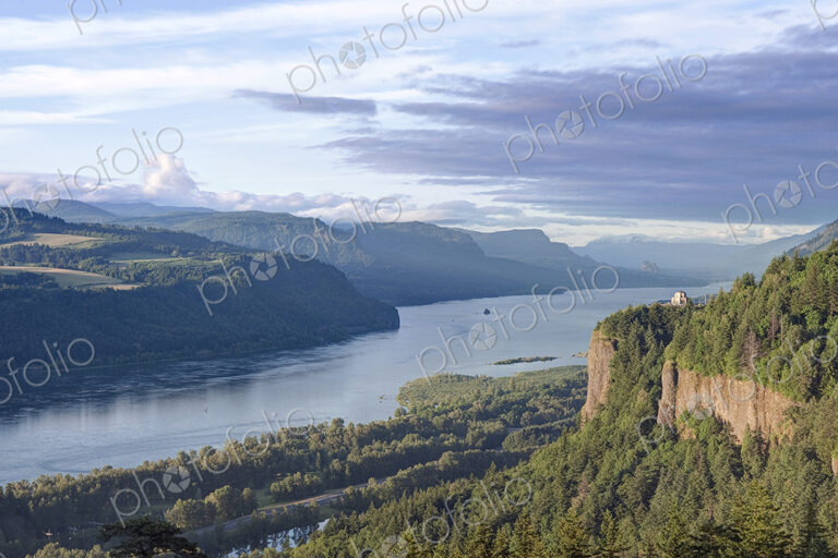 Cliff House and elevated view over the wide Columbia river and the landscape.