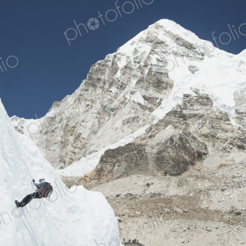 Climber using rope on mountain, Everest, Khumbu region, Nepal Climber using rope on mountain, Everest, Khumbu region, Nepal