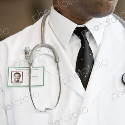 Close-up of a black man doctor with lab coat and stethescope.