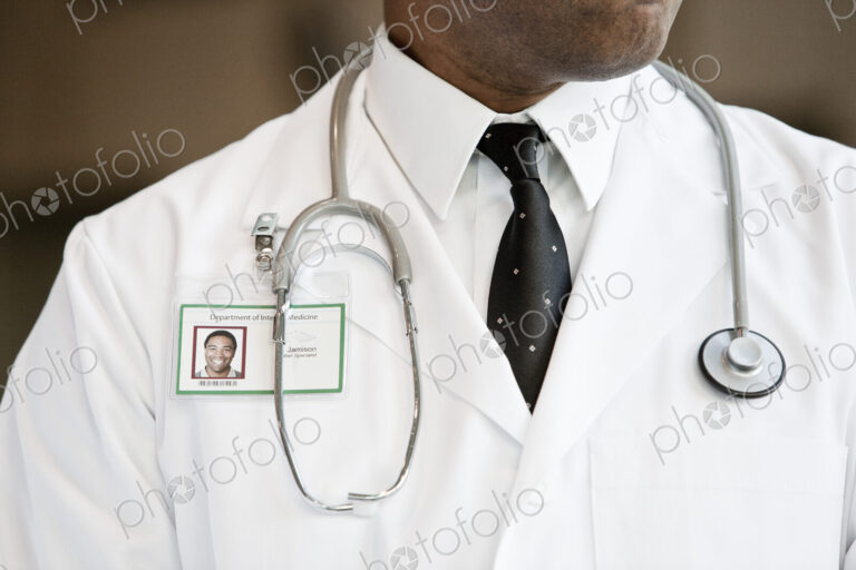 Close-up of a black man doctor with lab coat and stethescope.