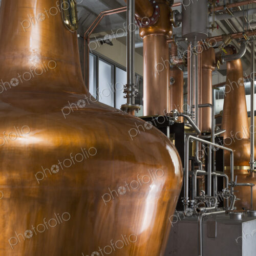 Close up of a copper still in a distillery, Washington, USA. Close up of a copper still in a distillery, Washington, USA.