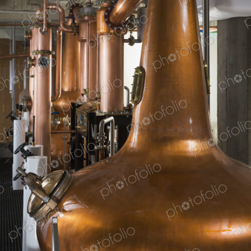 Close up of a copper still in a distillery, Washington, USA. Close up of a copper still in a distillery, Washington, USA.