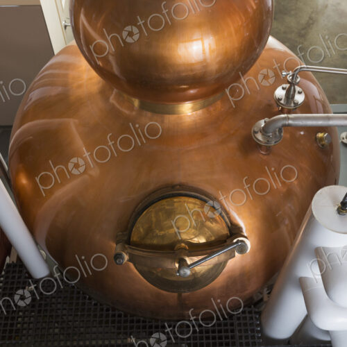 Close up of a copper still in a distillery, Washington, USA. Close up of a copper still in a distillery, Washington, USA.