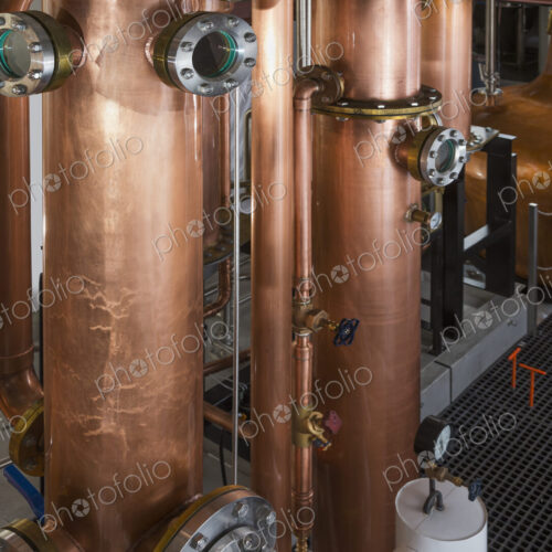 Close up of a copper still in a distillery, Washington, USA. Close up of a copper still in a distillery, Washington, USA.