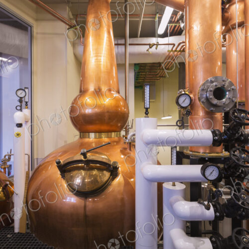 Close up of a copper still in a distillery, Washington, USA. Close up of a copper still in a distillery, Washington, USA.