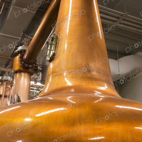 Close up of a copper still in a distillery, Washington, USA. Close up of a copper still in a distillery, Washington, USA.