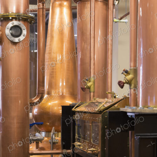 Close up of a copper still in a distillery, Washington, USA. Close up of a copper still in a distillery, Washington, USA.