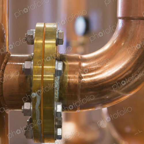Close up of a copper still in a distillery, Washington, USA. Close up of a copper still in a distillery, Washington, USA.