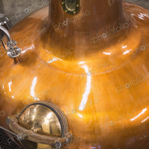 Close up of a copper still in a distillery, Washington, USA. Close up of a copper still in a distillery, Washington, USA.