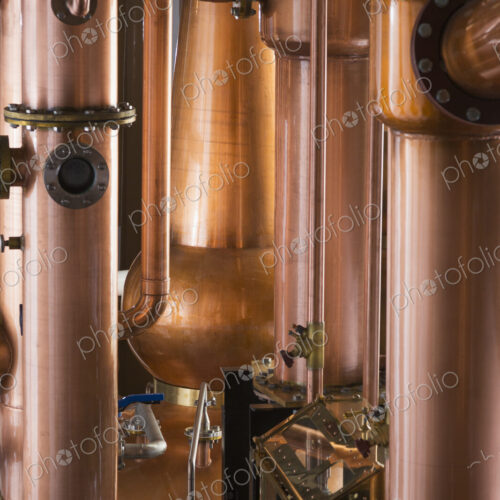 Close up of a copper still in a distillery, Washington, USA. Close up of a copper still in a distillery, Washington, USA.