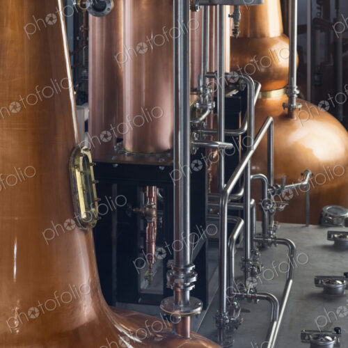 Close up of a copper still in a distillery, Washington, USA. Close up of a copper still in a distillery, Washington, USA.