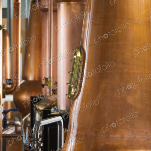 Close up of a copper still in a distillery, Washington, USA. Close up of a copper still in a distillery, Washington, USA.