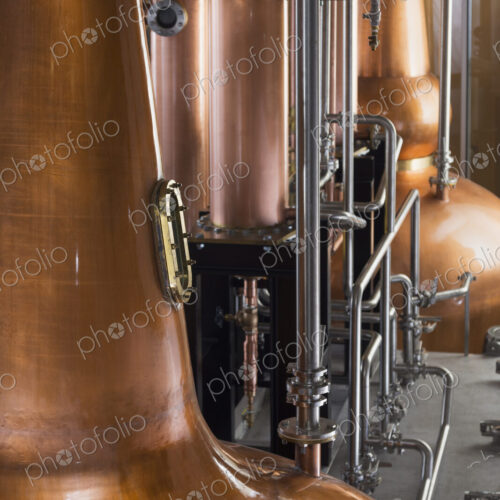 Close up of a copper still in a distillery, Washington, USA. Close up of a copper still in a distillery, Washington, USA.