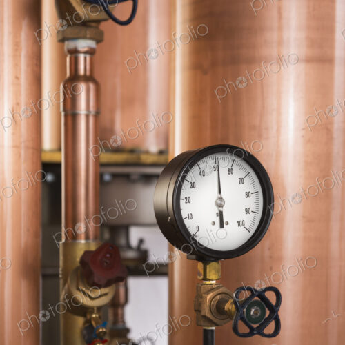 Close up of a copper still in a distillery, Washington, USA. Close up of a copper still in a distillery, Washington, USA.