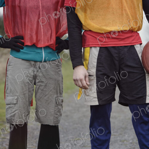 Close up of a friends getting ready for an American Flag Football game.