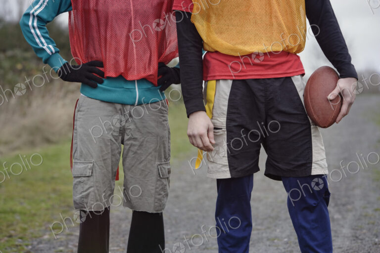Close up of a friends getting ready for an American Flag Football game.