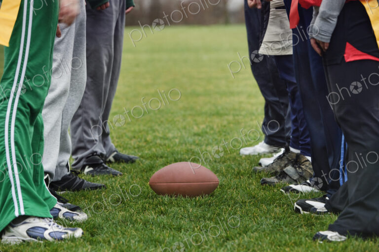 Close up of a friends getting ready for an American Flag Football game.
