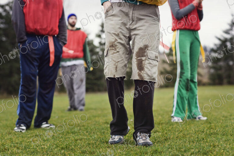Close up of a friends getting ready for an American Flag Football game.