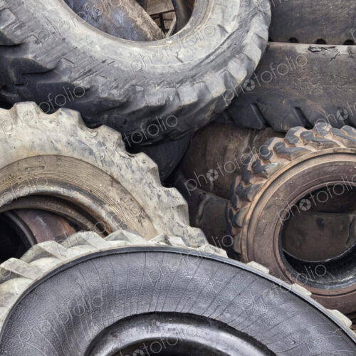 Close up of a heap of old vehicle rubber tyres. Close up of a heap of old vehicle rubber tyres.