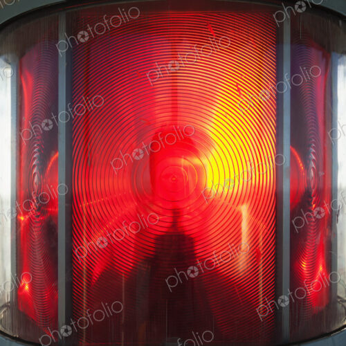 Close up of a lantern and lightbulb, radiating heat and light, red and yellow. Close up of a lantern and lightbulb, radiating heat and light, red and yellow.