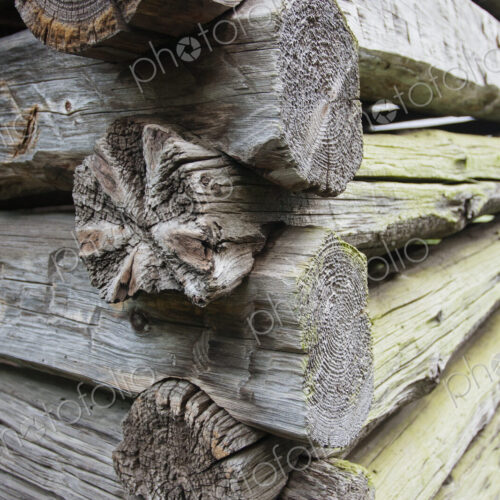 Close up of a log cabin with weathered wooden logs fitted closely together. Close up of a log cabin with weathered wooden logs fitted closely together.
