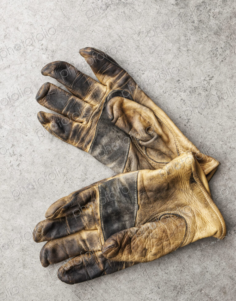 Close-up of a pair of used work gloves in a shop