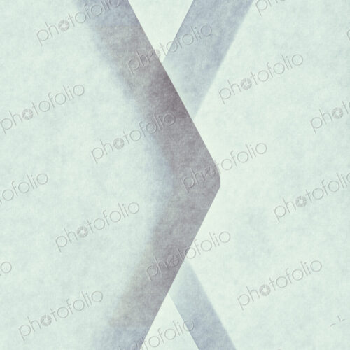 Close up of a paper envelope with glued borders, above a light source.