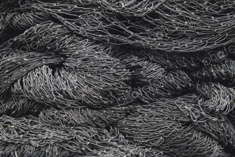 Close up of a pile of tangled up commercial fishing nets.