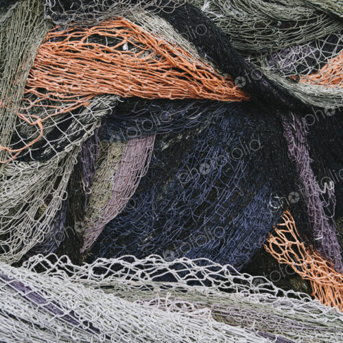 Close up of a pile of tangled up commercial fishing nets. Close up of a pile of tangled up commercial fishing nets.