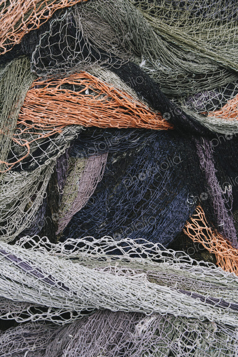 Close up of a pile of tangled up commercial fishing nets.