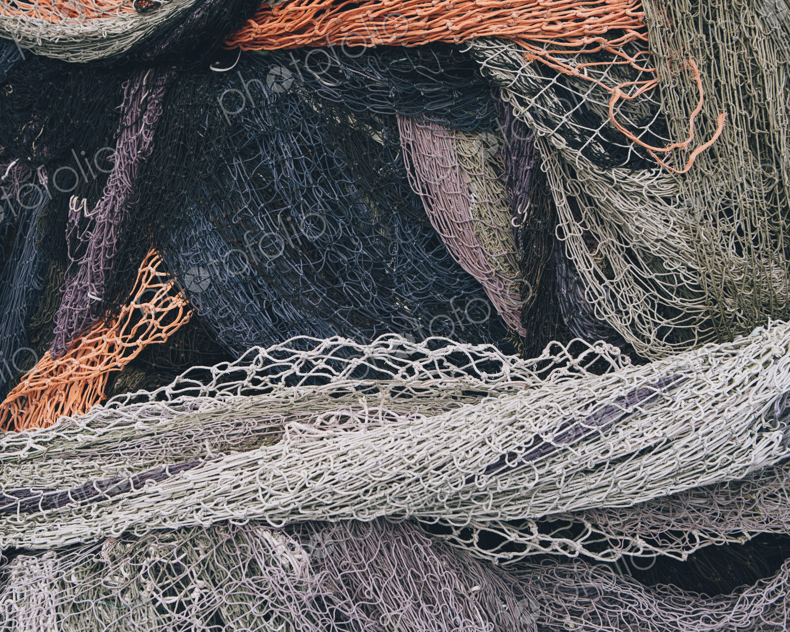 Close up of a pile of tangled up commercial fishing nets.