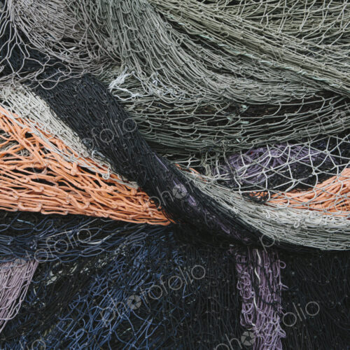 Close up of a pile of tangled up commercial fishing nets. Close up of a pile of tangled up commercial fishing nets.
