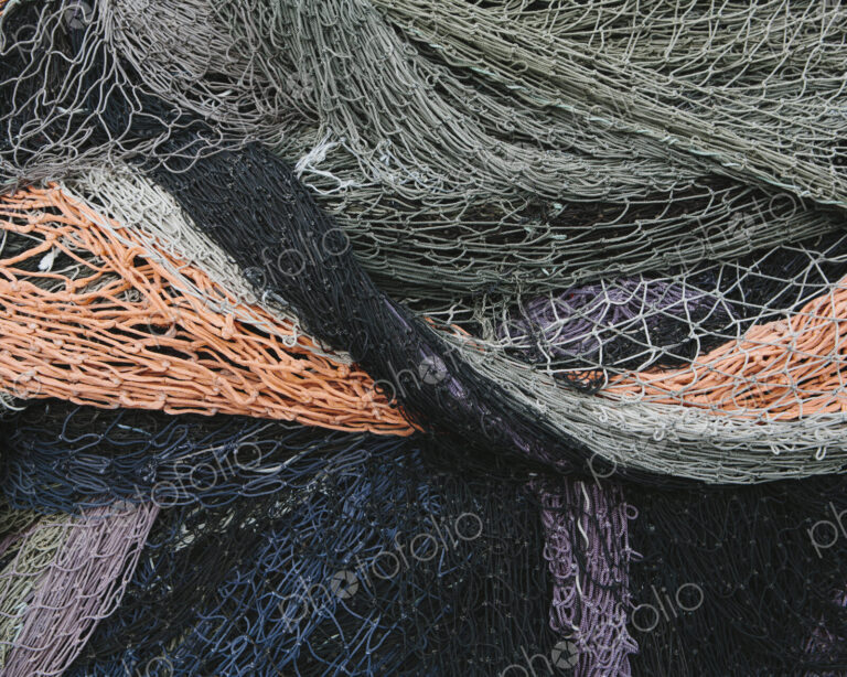 Close up of a pile of tangled up commercial fishing nets.