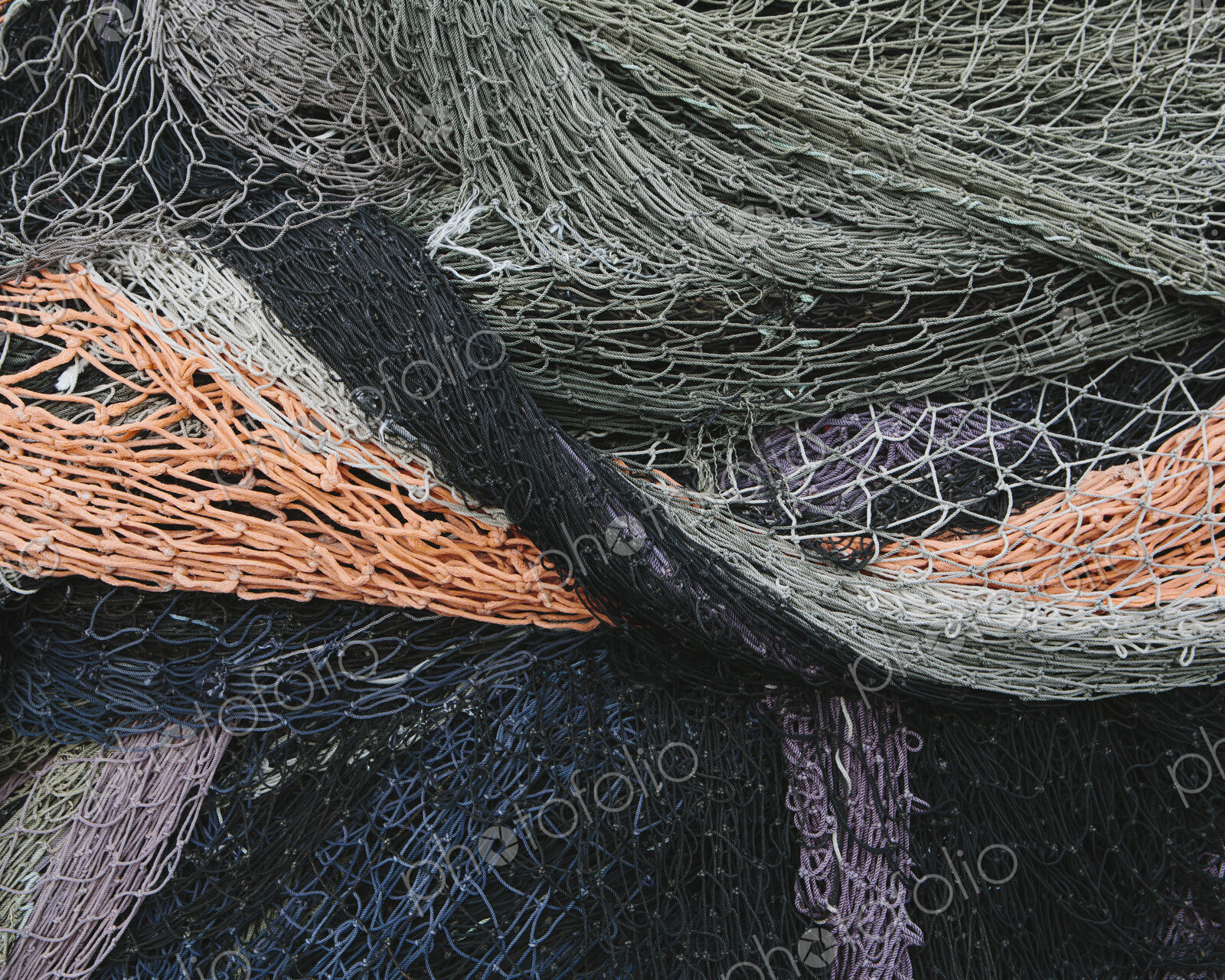 Close up of a pile of tangled up commercial fishing nets.