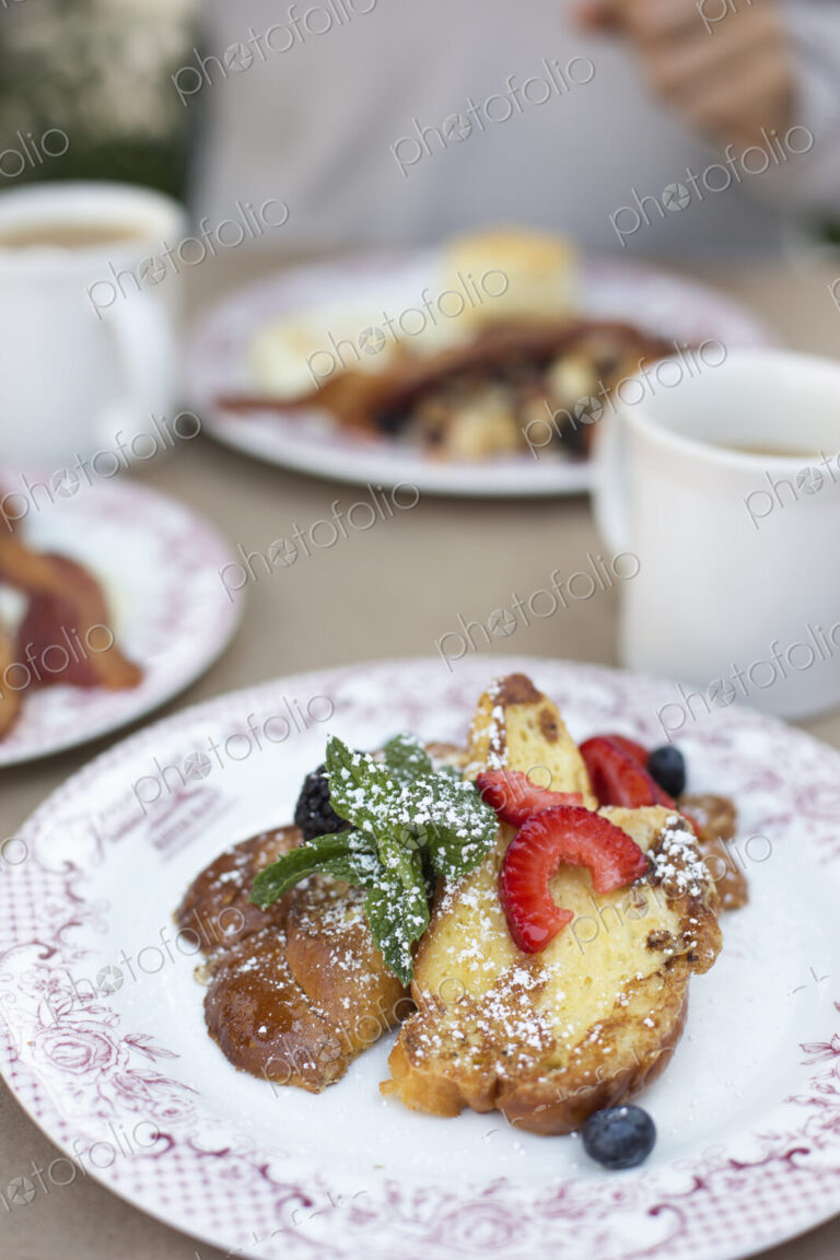 Close up of a plate of food, French toast with berries.