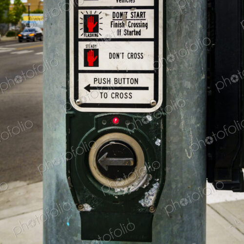 Close up of a road crossing signal information panel and button to press.. Close up of a road crossing signal information panel and button to press..