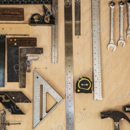 Close up of a selection of tools on a wall in a woodworking workshop. Close up of a selection of tools on a wall in a woodworking workshop.