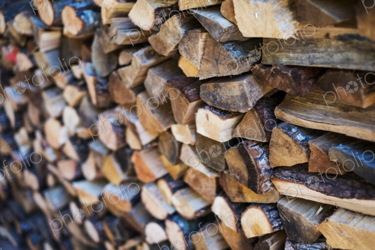 Close up of a stack of firewood logs.