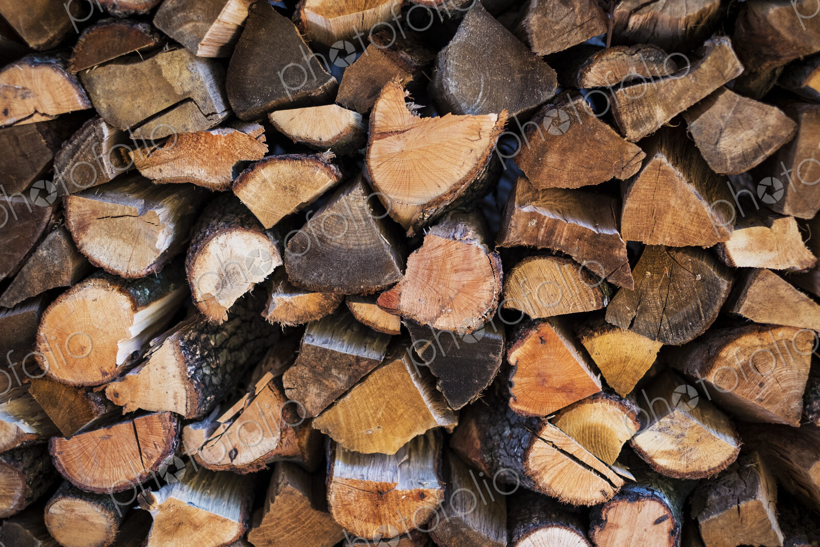 Close up of a stack of firewood logs.
