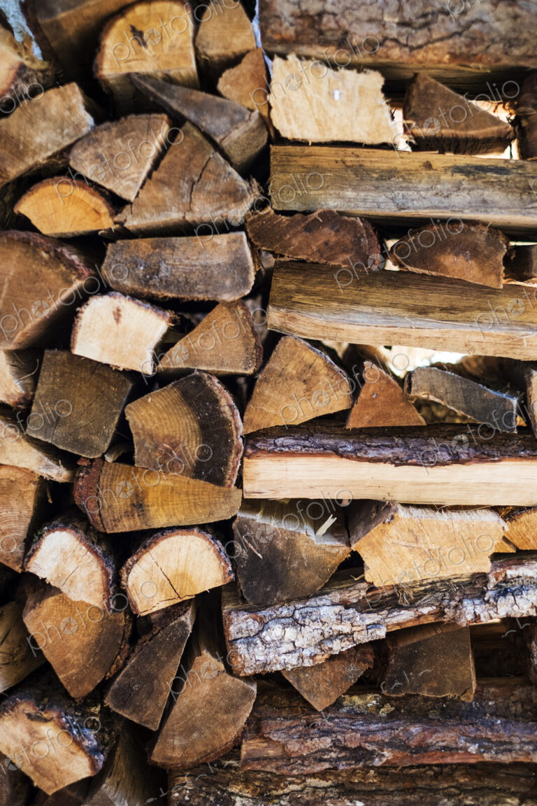 Close up of a stack of firewood logs.