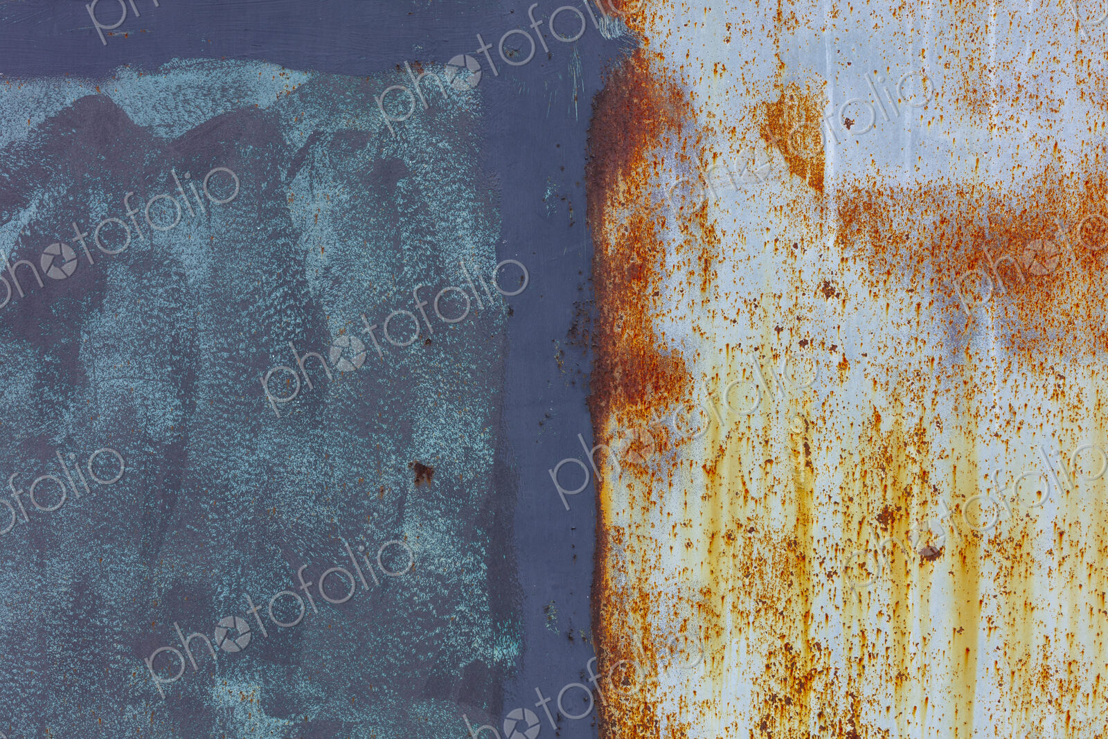 Close up of a wall, with rust and paint marks, vandalism and decay.
